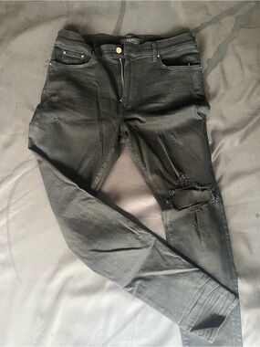 AMIRI Black Distressed Skinny Jeans
